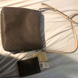 Michael Kors jet set travel purse and matching wallet. Used but looks great.